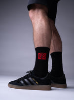 A studio shot of Red Notice Crew Socks in Obsidian Black (SS)