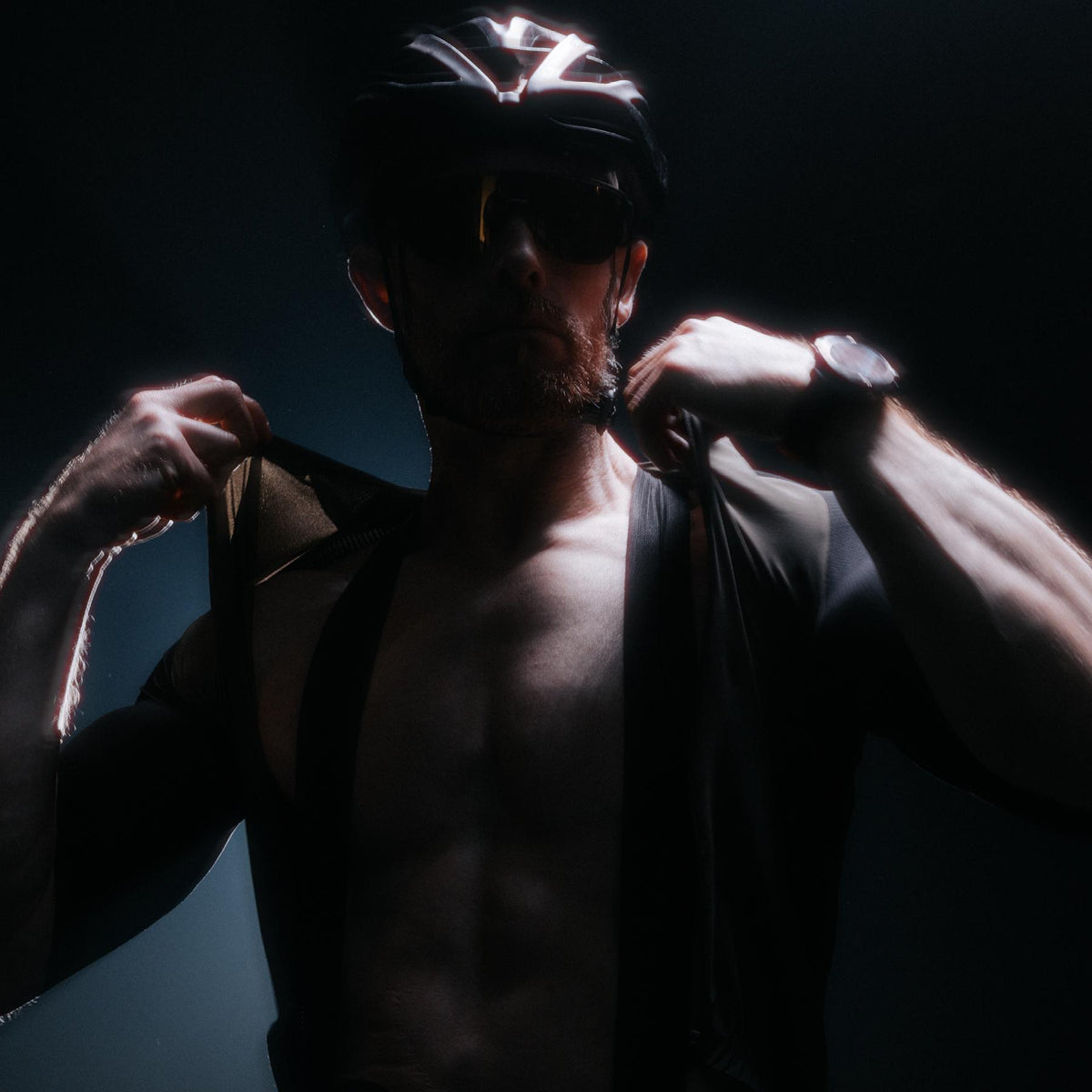 A creative studio shot of Men's Force Cadence Road Bib Shorts in Obsidian Black (CS)