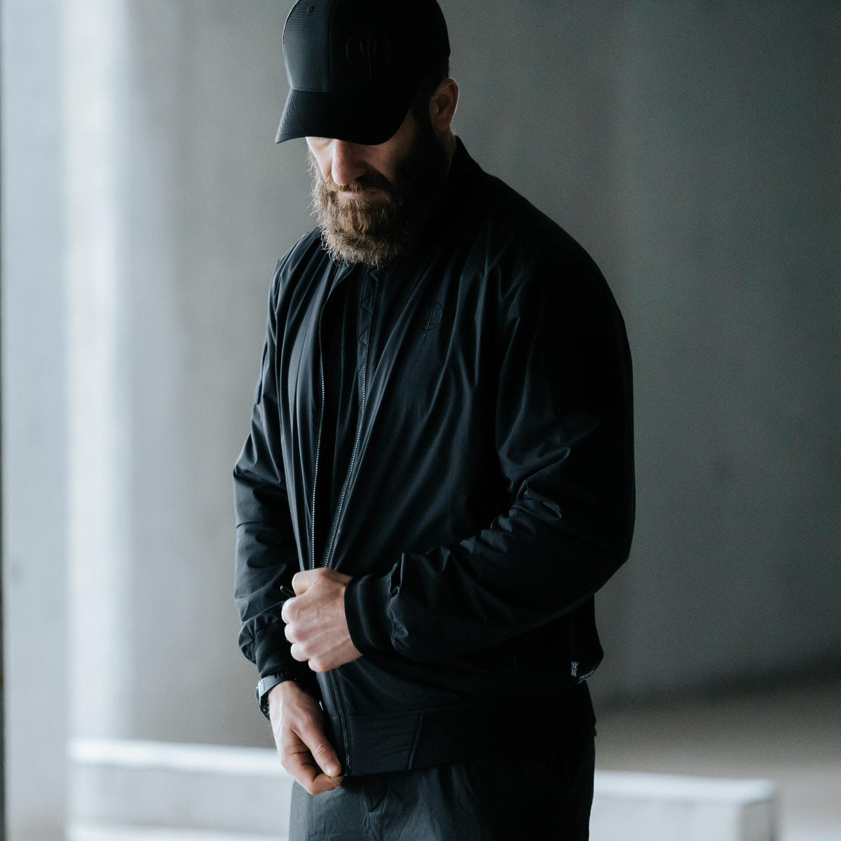 An in the field image of Men's Wraith Bomber Jacket in Obsidian Black (ITF)