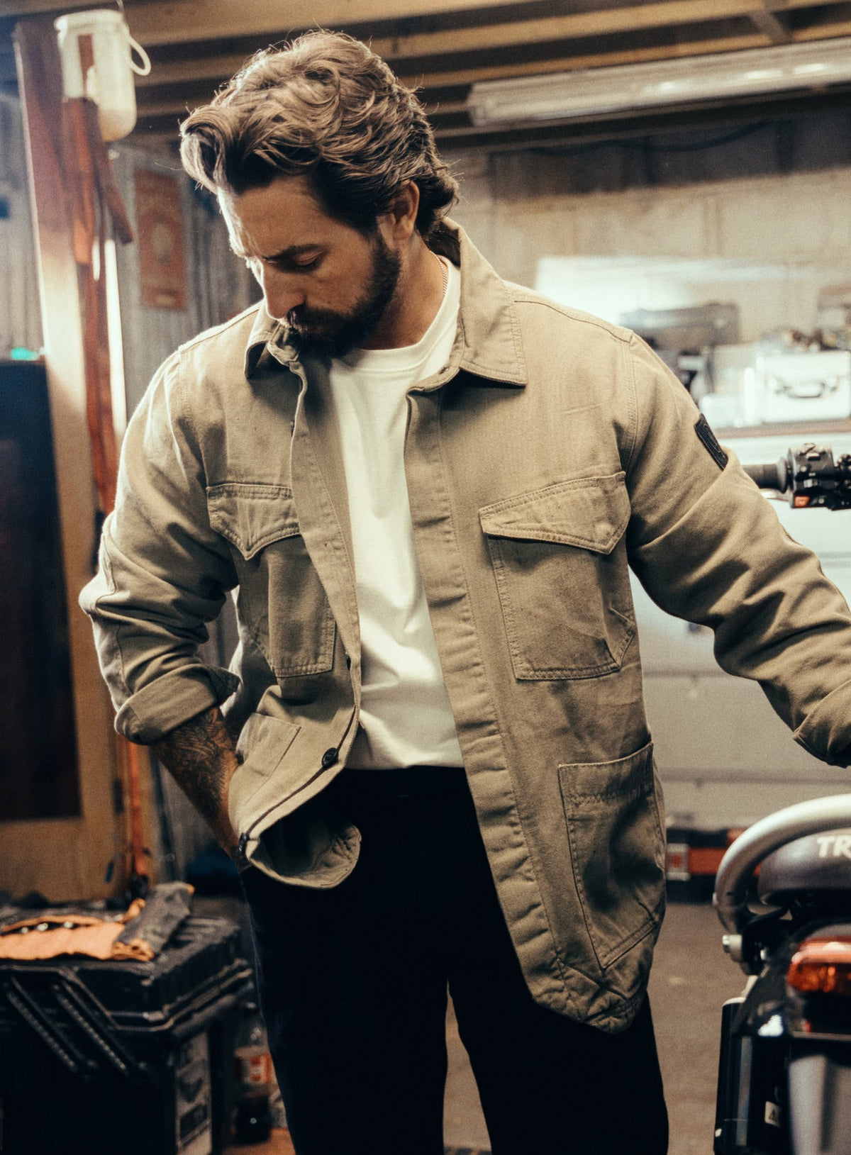 An in the field image of Men's Dissident Canvas Jacket in Khaki (ITF)