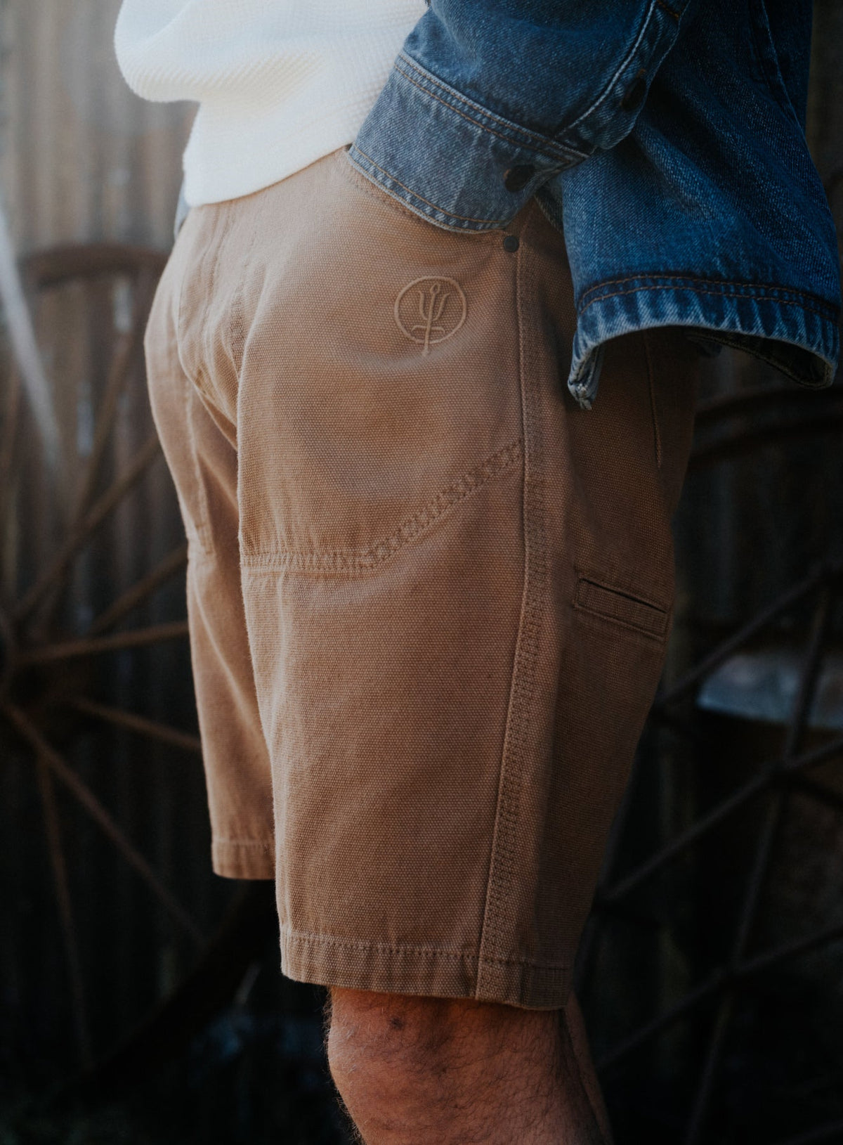 An in the field image of Men's Dissident Canvas Shorts in Coyote Brown (ITF)