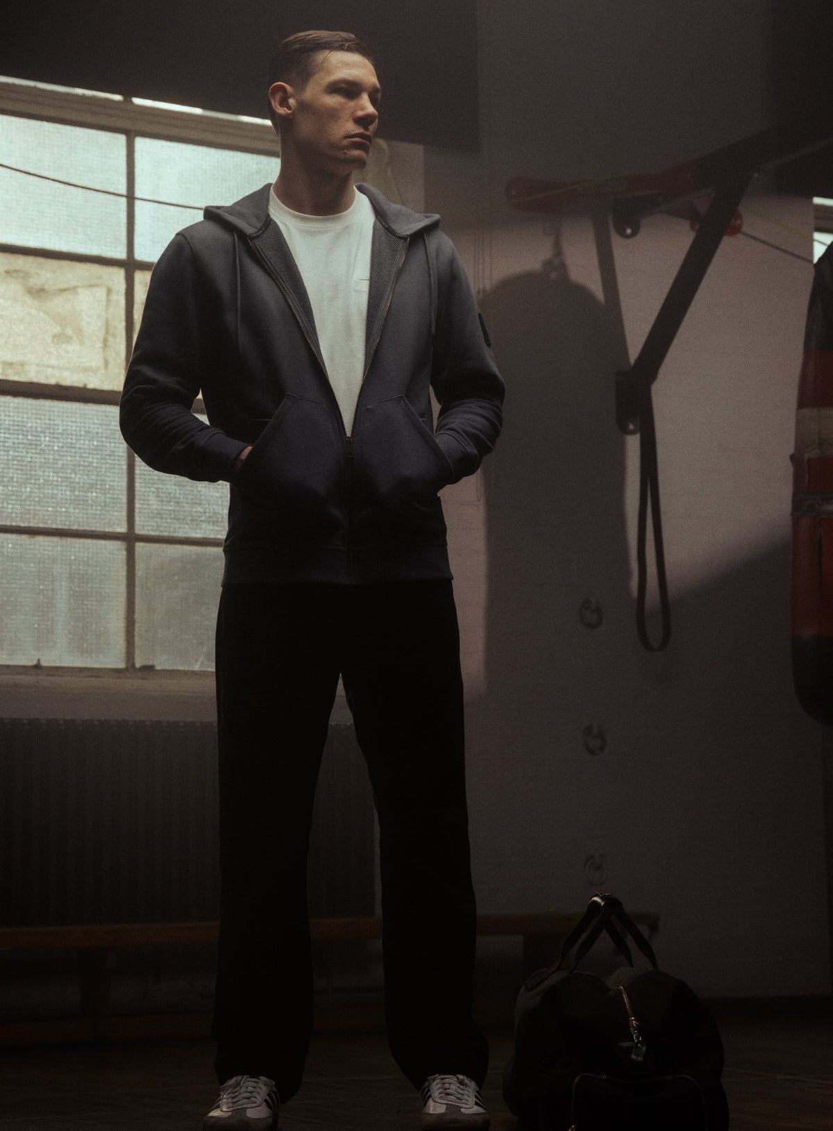 An in the field image of Men's Dissident Zipped Hoodie in Storm Blue (ITF)