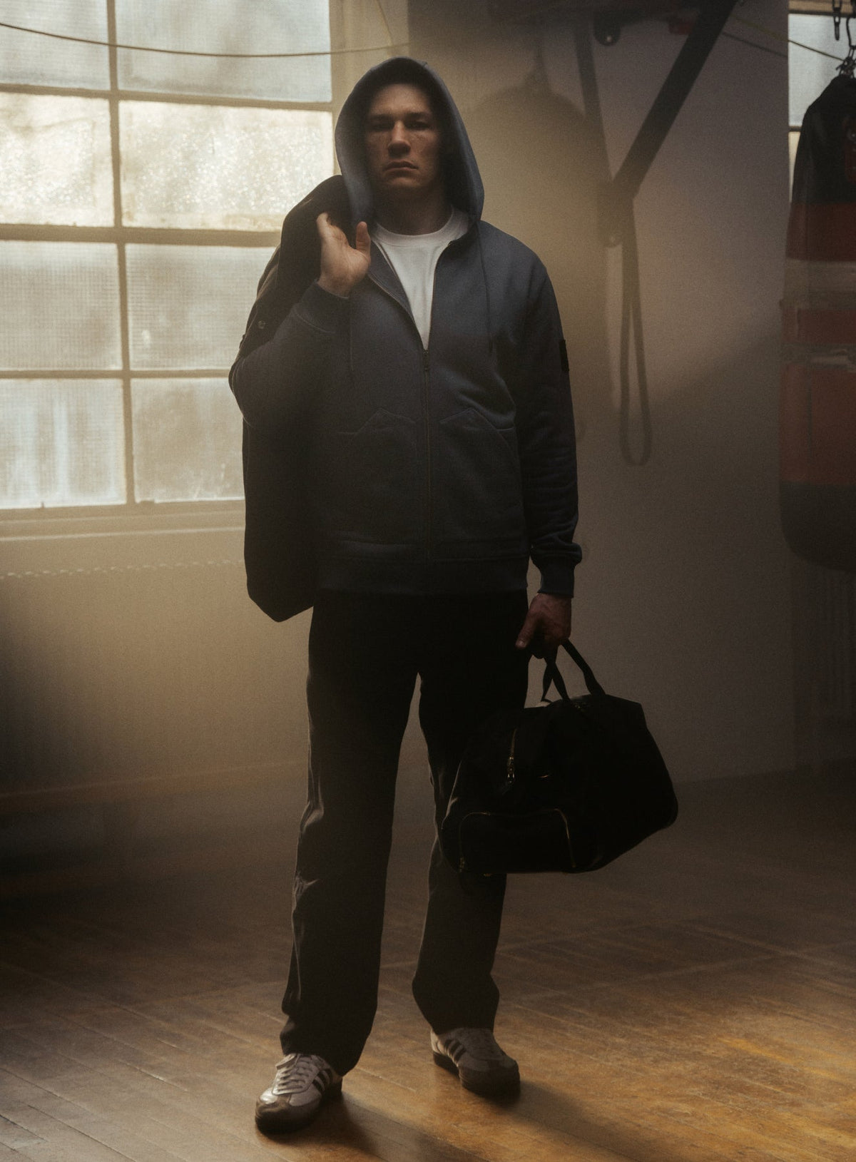 An in the field image of Men's Dissident Zipped Hoodie in Storm Blue (ITF)