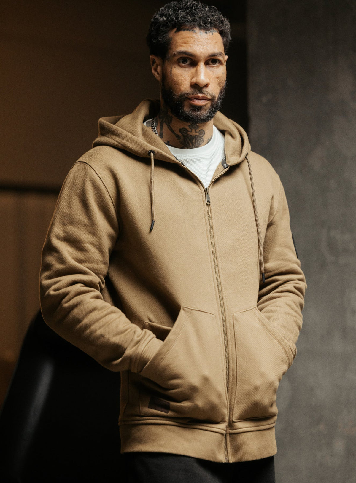 An in the field image of Men's Dissident Zipped Hoodie in Coyote Brown (ITF)