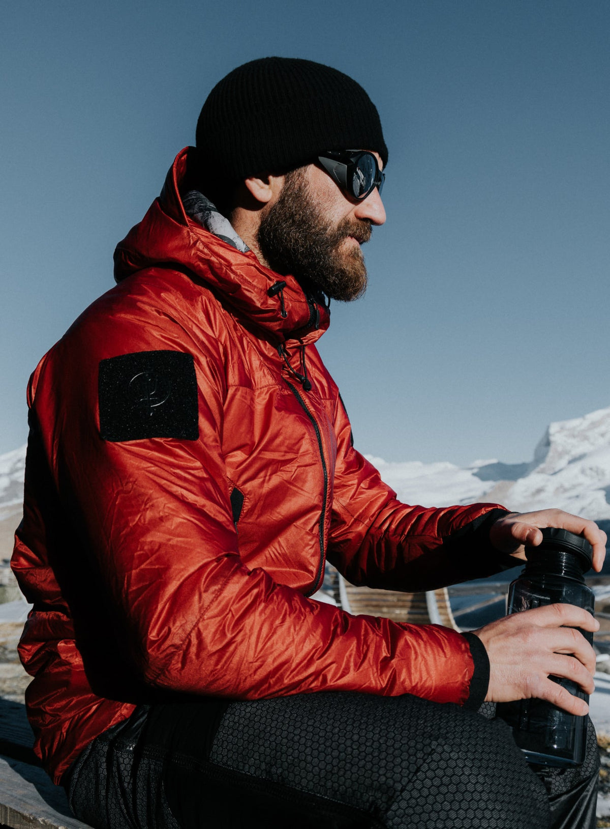 An in the field image of Men's Engage Jacket in Crimson Red (ITF)