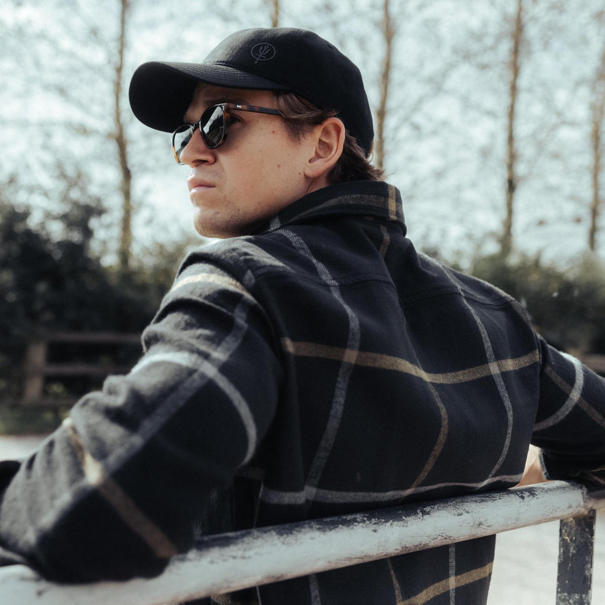 An in the field image of Men's HeriTech Thicket Flannel Shirt in Obsidian Black (ITF)