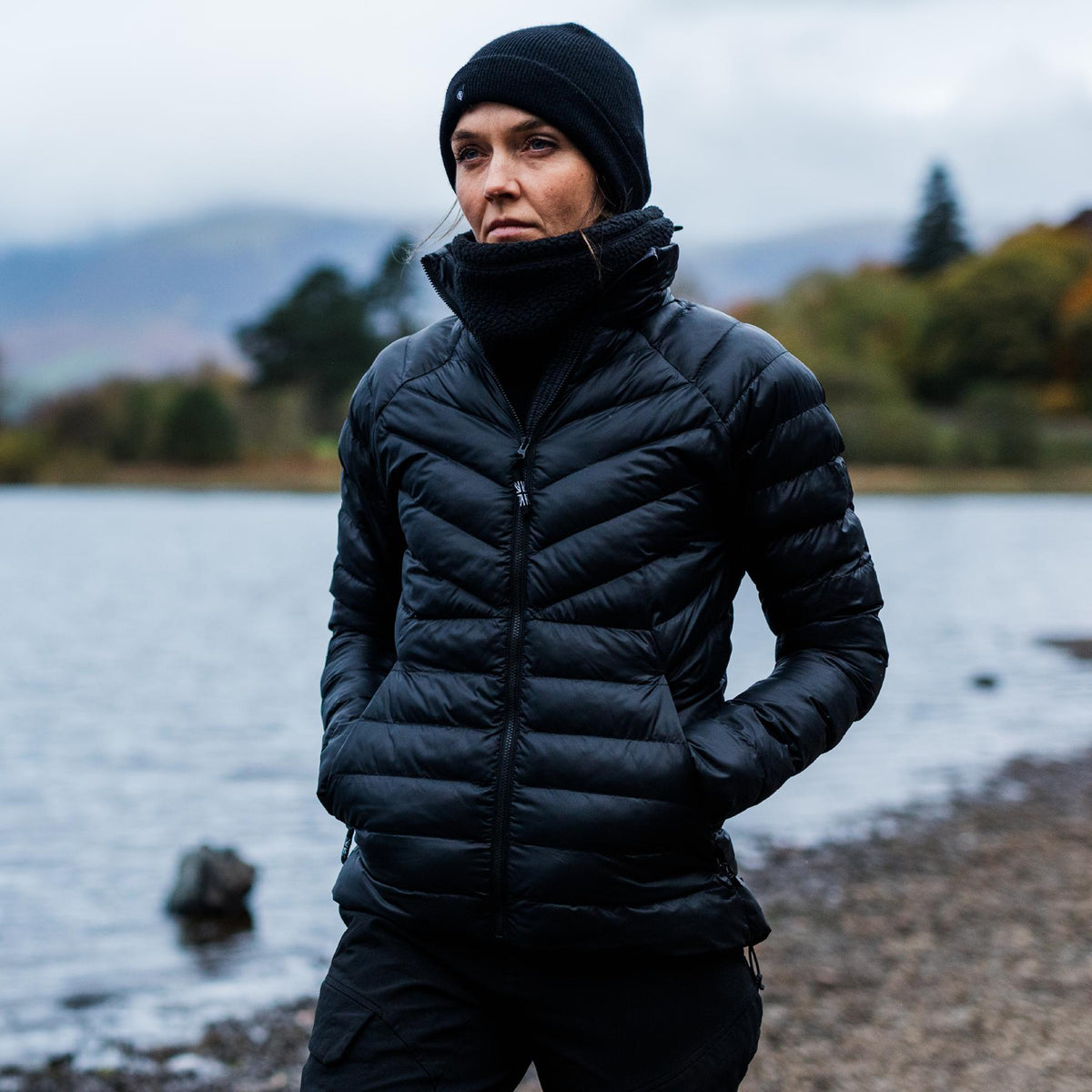 An in the field image of Women's Ithax Funnel Jacket in Obsidian Black (ITF)