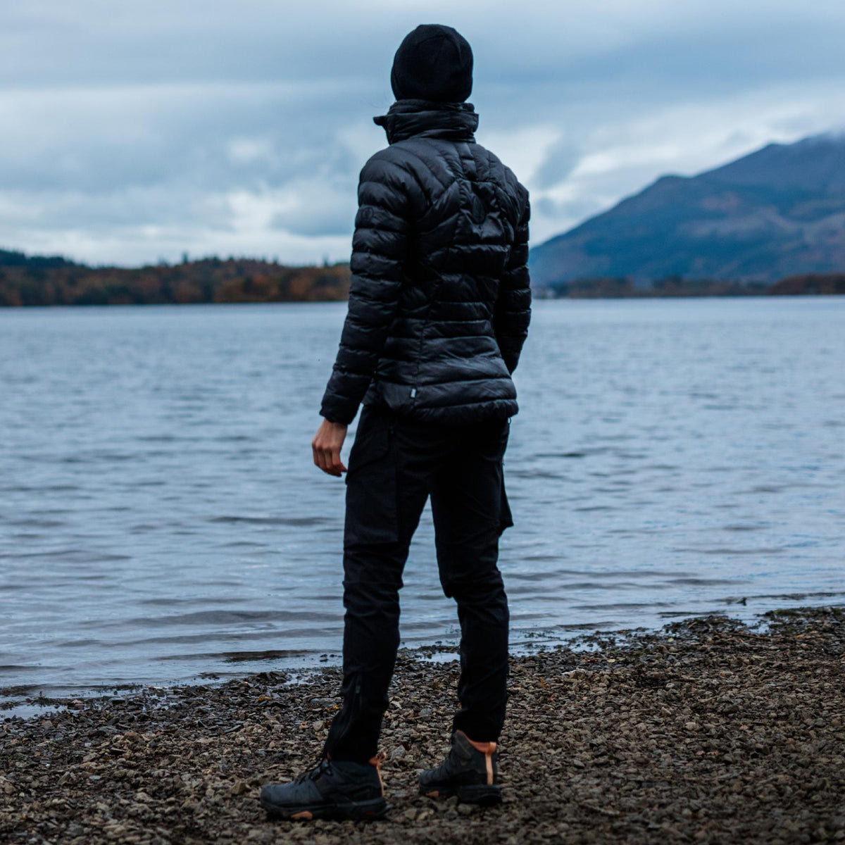 An in the field image of Women's Ithax Funnel Jacket in Obsidian Black (ITF)