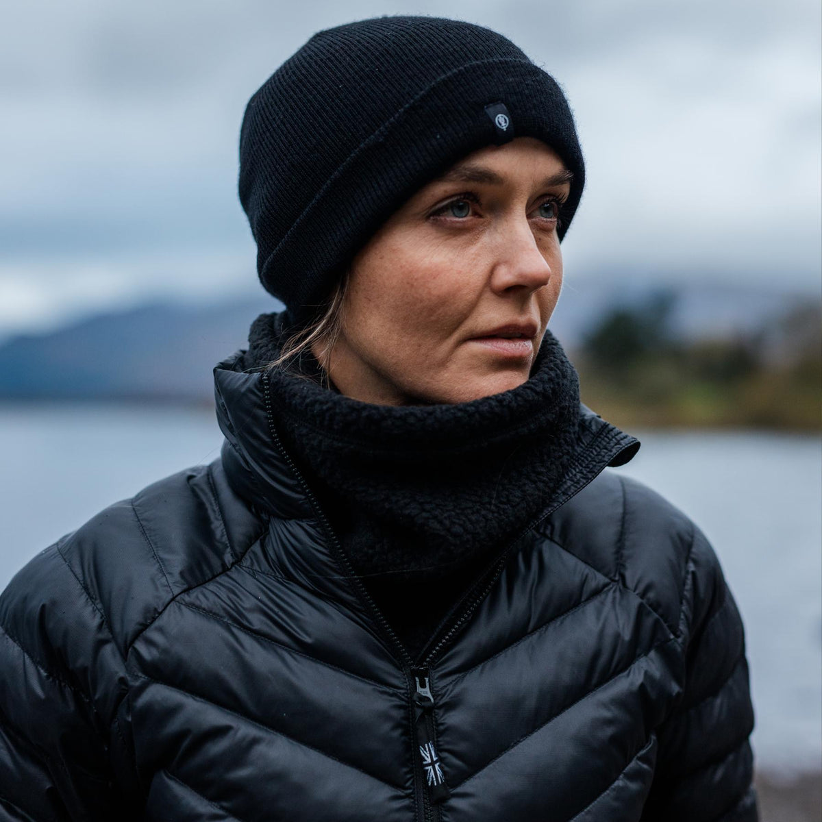 An in the field image of Women's Ithax Funnel Jacket in Obsidian Black (ITF)
