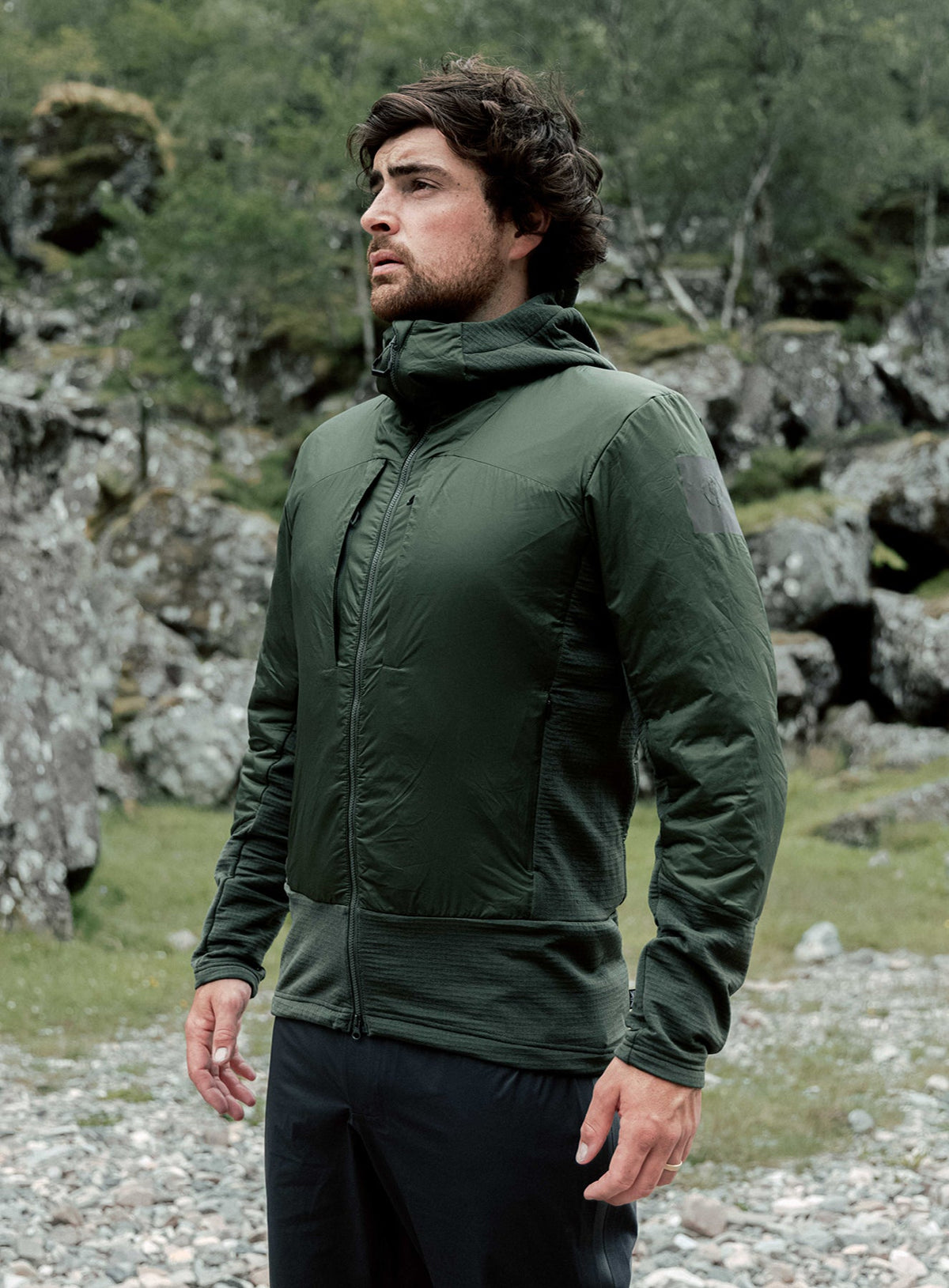 An in the field image of Men's Mountain Pro Fusion Jacket in Forest Green (ITF)