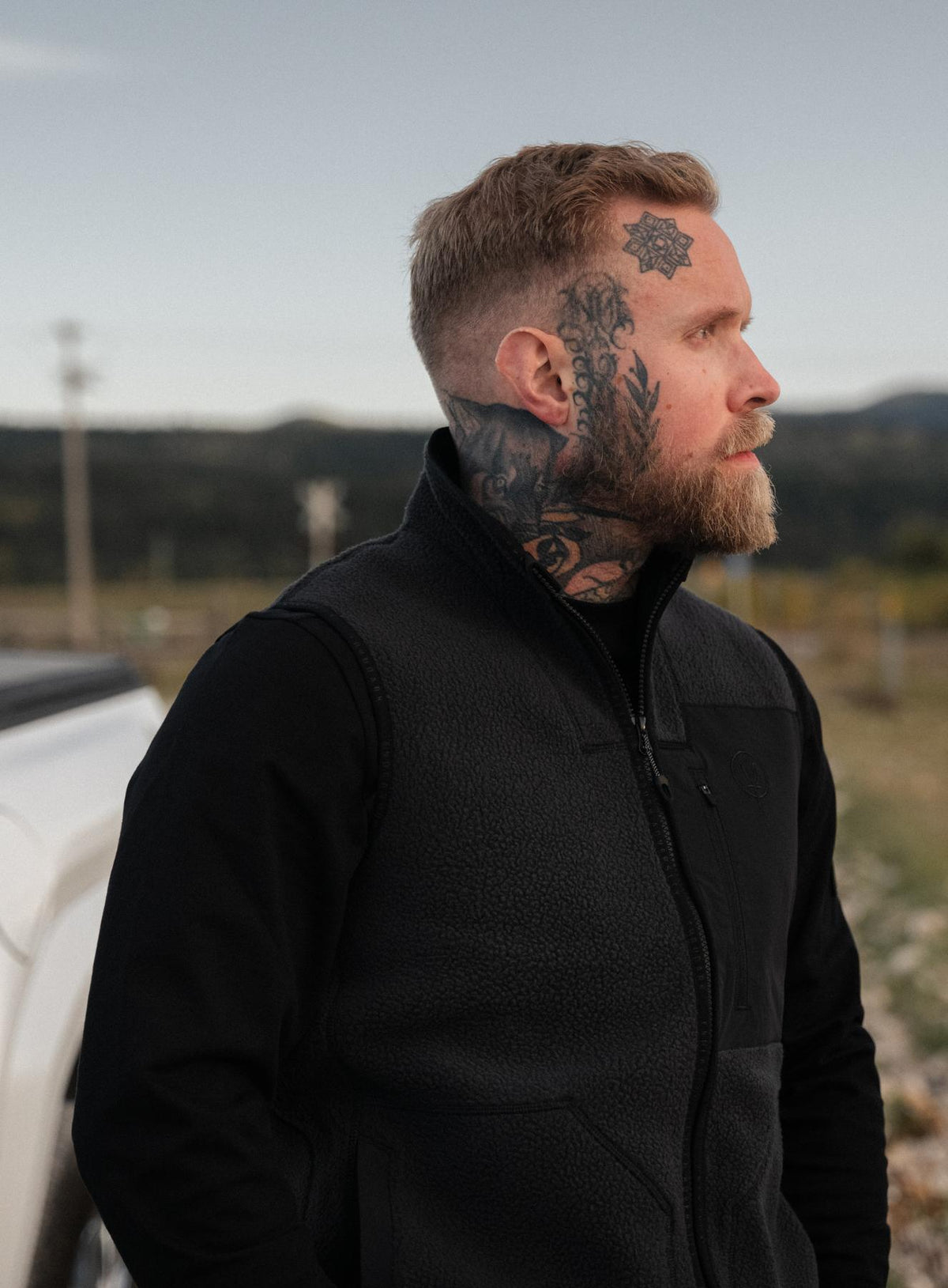 Max Is 5ft 8" And Wears Size: M | Hem Studio Image Of Model Wearing Mantra Gilet In Obsidian Black (SS Model)