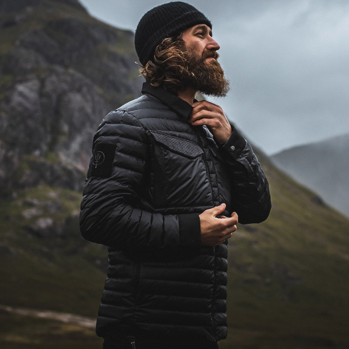An in the field image of Men's Melee Down Jacket in Obsidian Black (ITF)