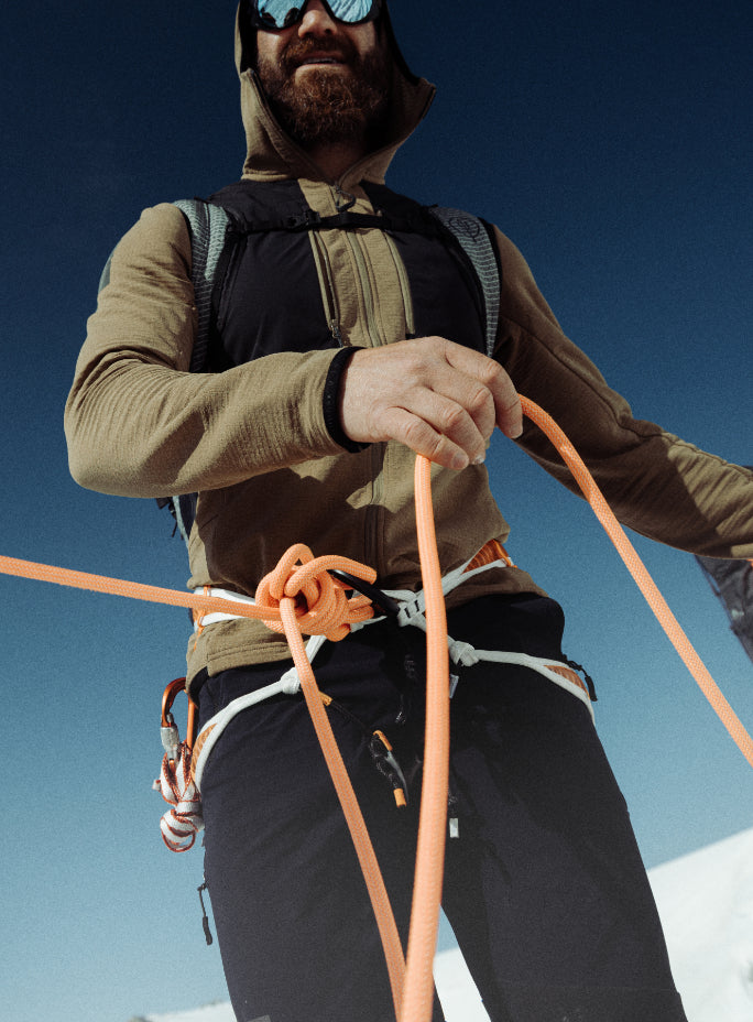 An in the field image of Men's Mountain Pro Technical Mid Layer in Coyote Brown (ITF)