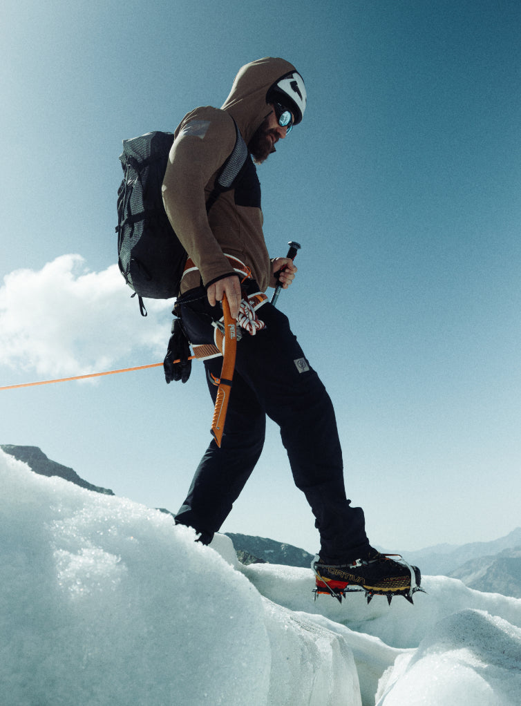 An in the field image of Men's Mountain Pro Technical Mid Layer in Coyote Brown (ITF)