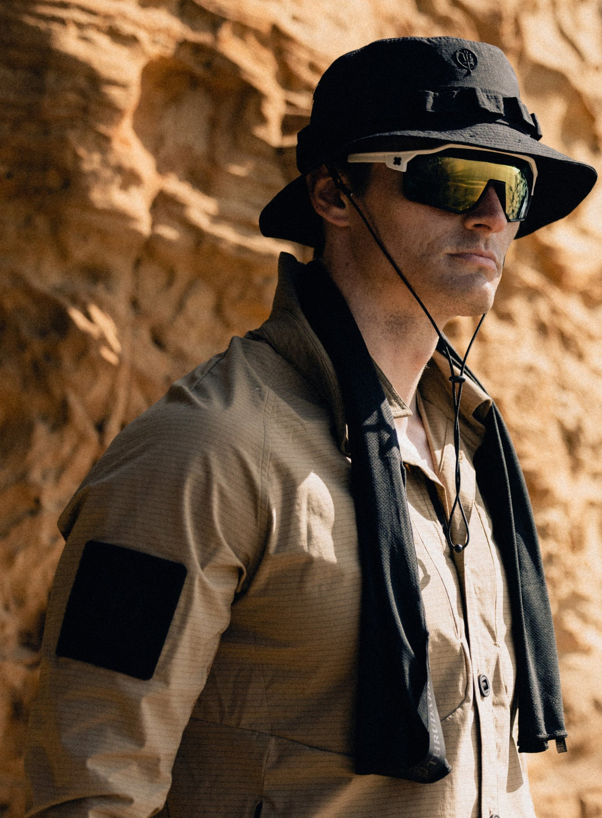 An in the field image of New Era Desert Bucket Hat in Obsidian Black (ITF)