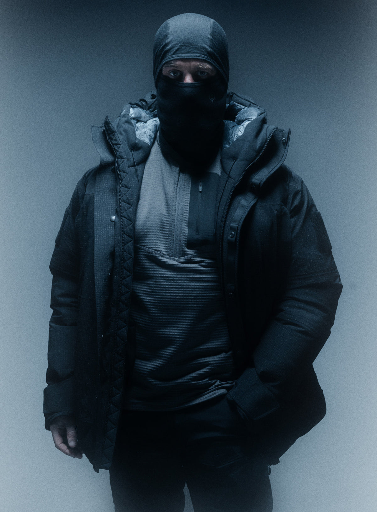 A creative studio shot of Men's Palisade Down Insulated Jacket in Obsidian Black (CS)