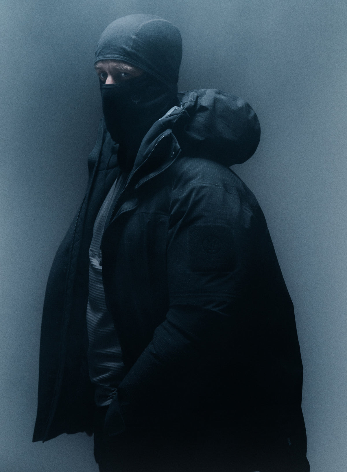 A creative studio shot of Men's Palisade Down Insulated Jacket in Obsidian Black (CS)