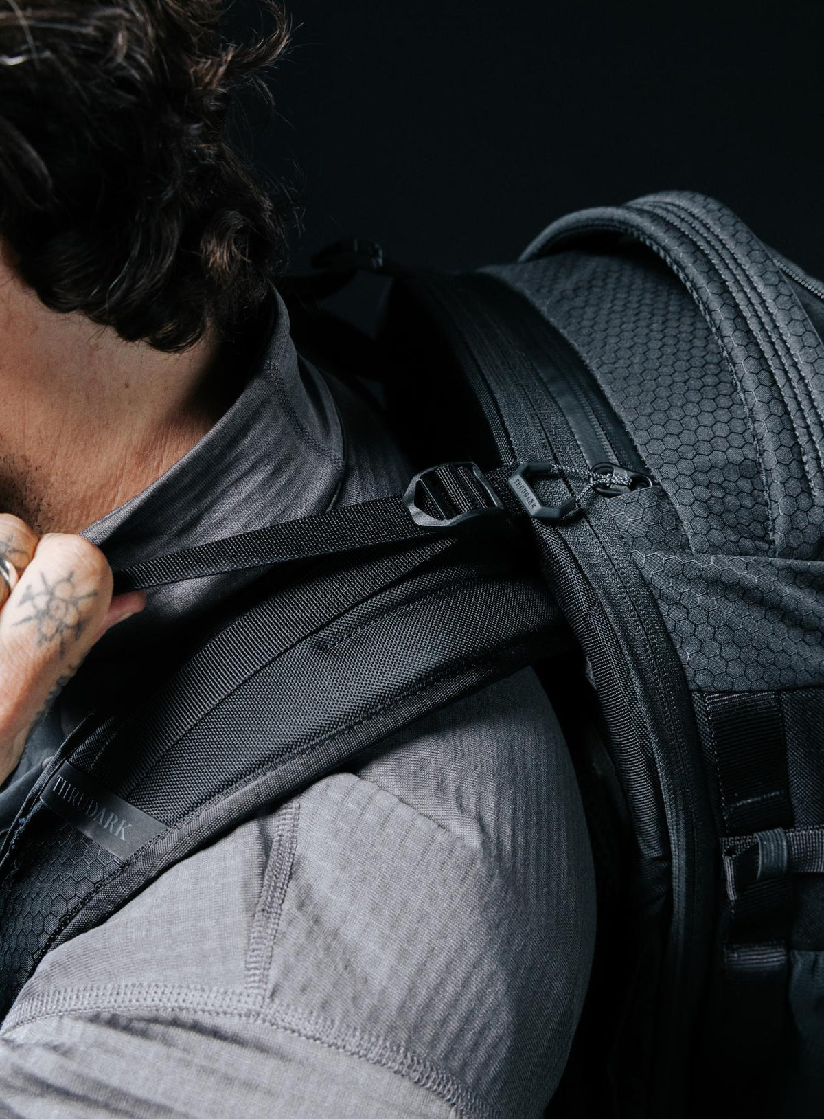 A creative studio shot of Phantom 40L Backpack in Obsidian Black (CS)