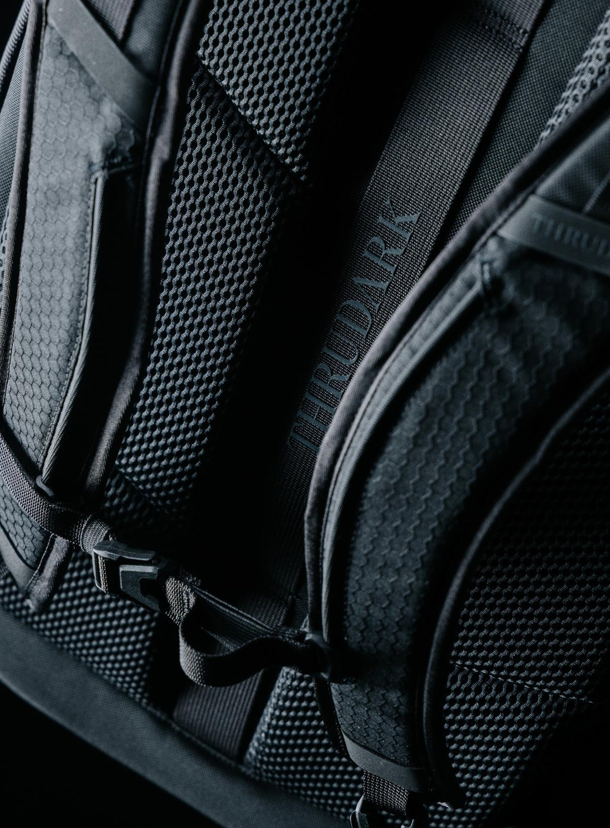 A creative studio shot of Phantom 40L Backpack in Obsidian Black (CS)