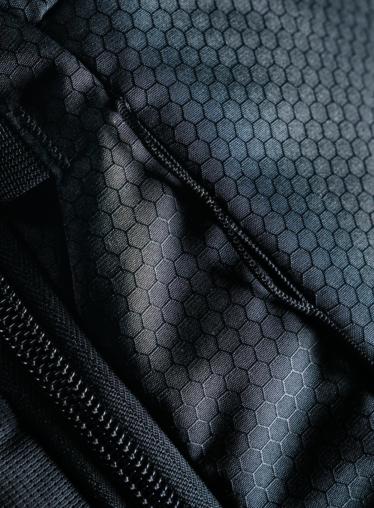 A creative studio shot of Phantom 40L Backpack in Obsidian Black (CS)