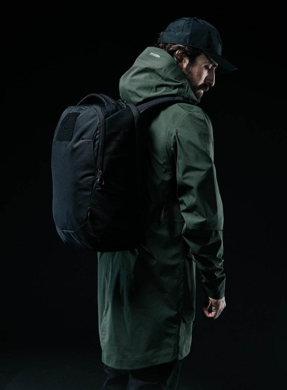 A creative studio shot of Phantom 25L Backpack in Obsidian Black (CS)