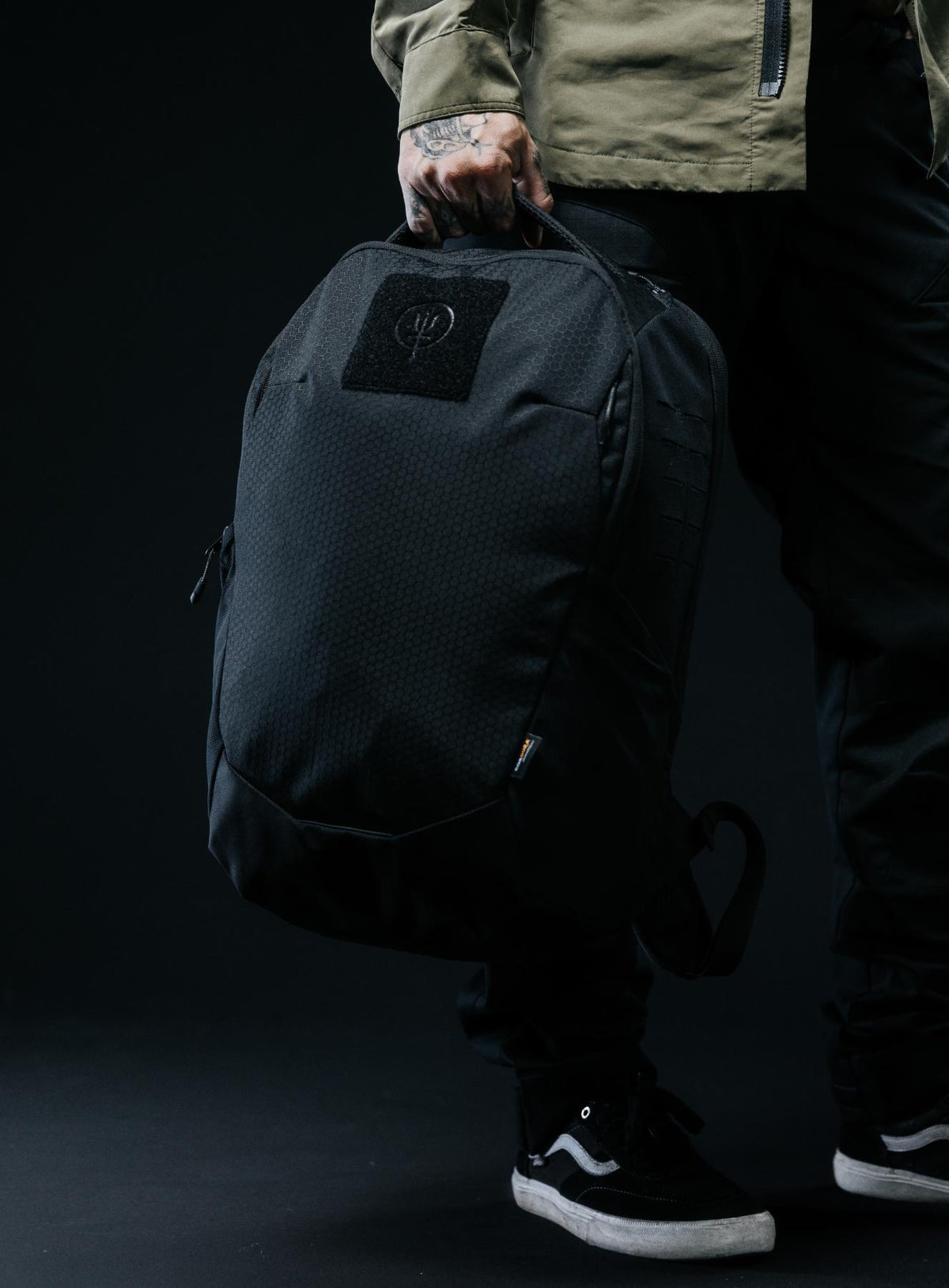 A creative studio shot of Phantom 25L Backpack in Obsidian Black (CS)