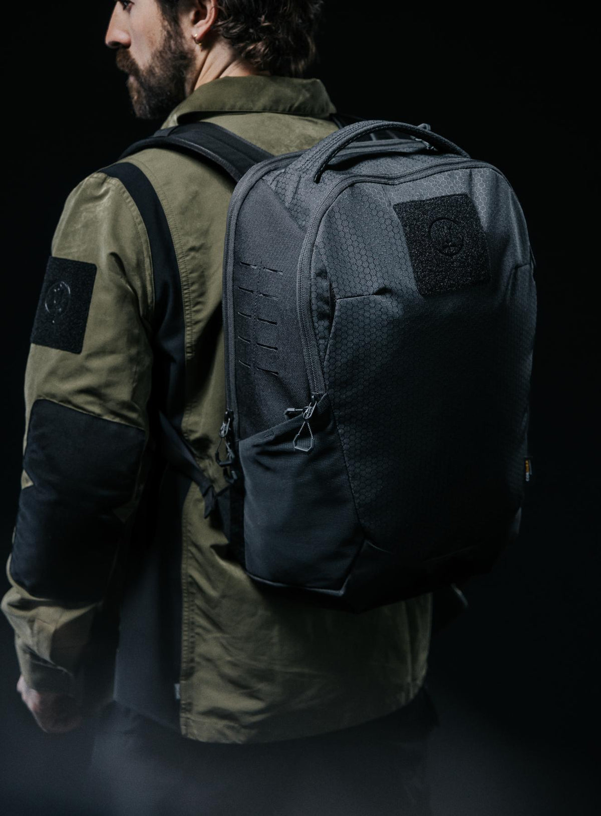 A creative studio shot of Phantom 25L Backpack in Obsidian Black (CS)