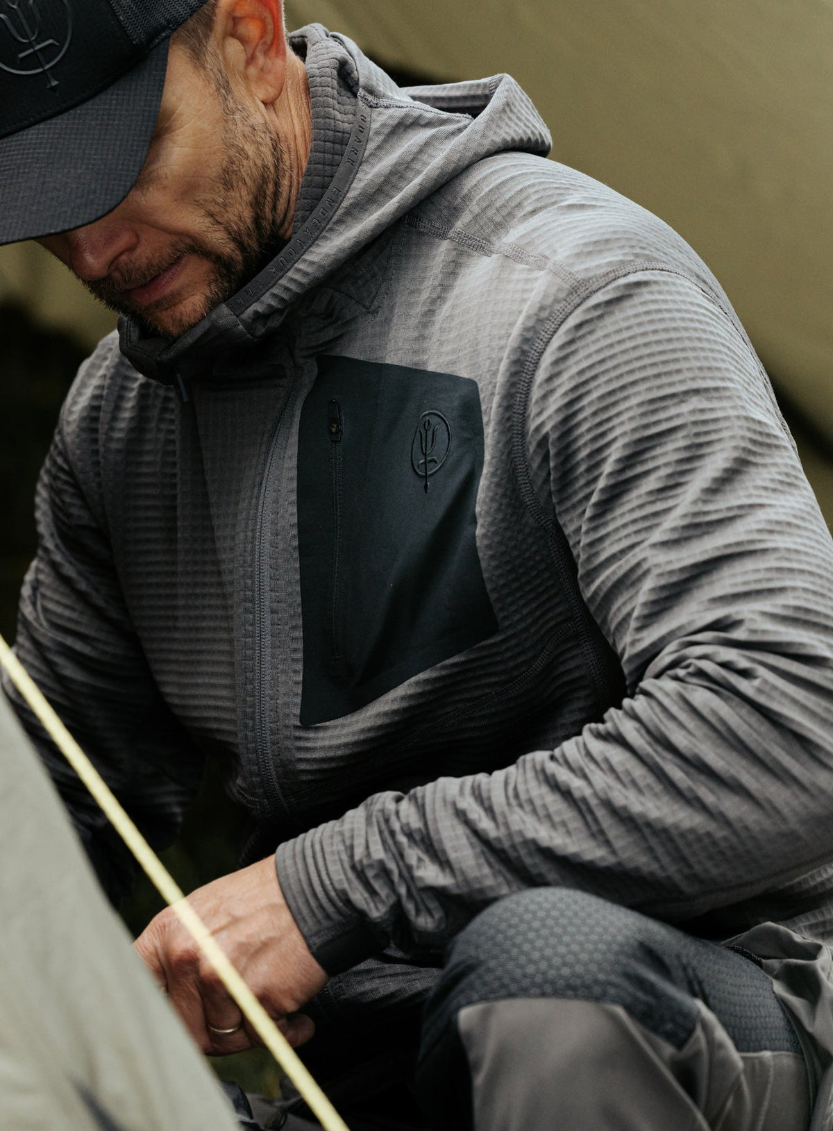 An in the field image of Men's Siege Tech Fleece Hooded in Wolf Grey (ITF)