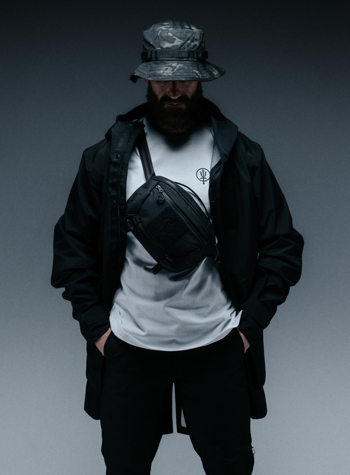 A creative studio shot of Spectral 5L Waist Pack in Obsidian Black (CS)