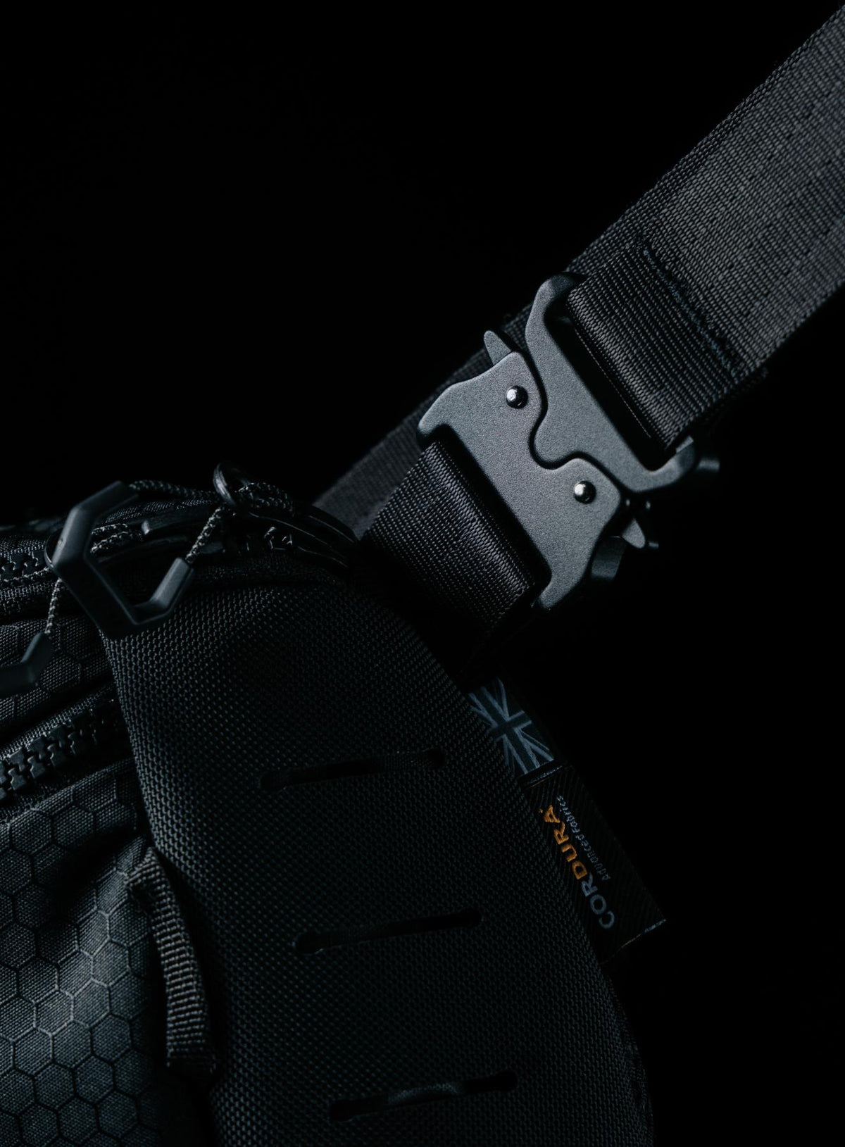 A creative studio shot of Spectral 5L Waist Pack in Obsidian Black (CS)