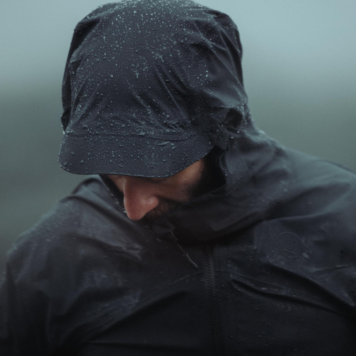 An in the field image of Men's Vanguard Jacket in Obsidian Black (ITF)