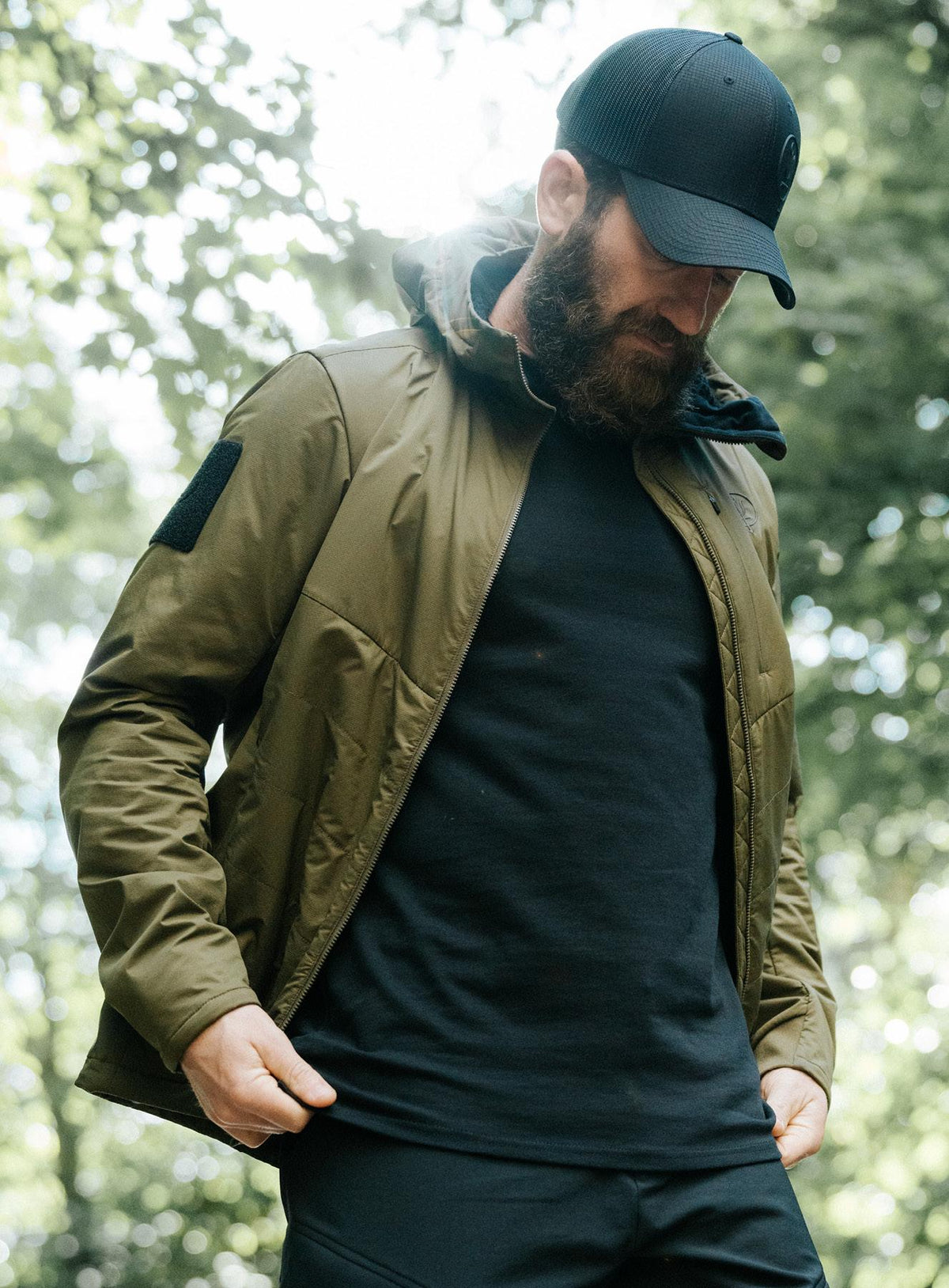 An in the field image of Men's Wraith Hooded Jacket in Khaki (ITF)