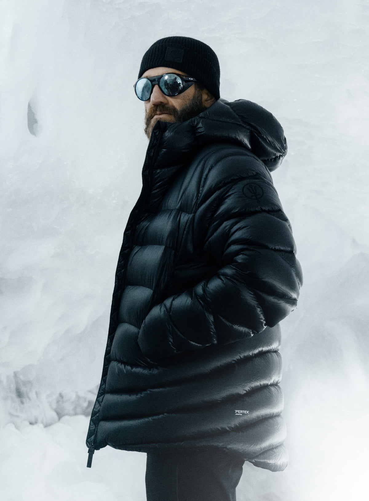 An in the field image of Men's Bastion Down Jacket in Obsidian Black (ITF)