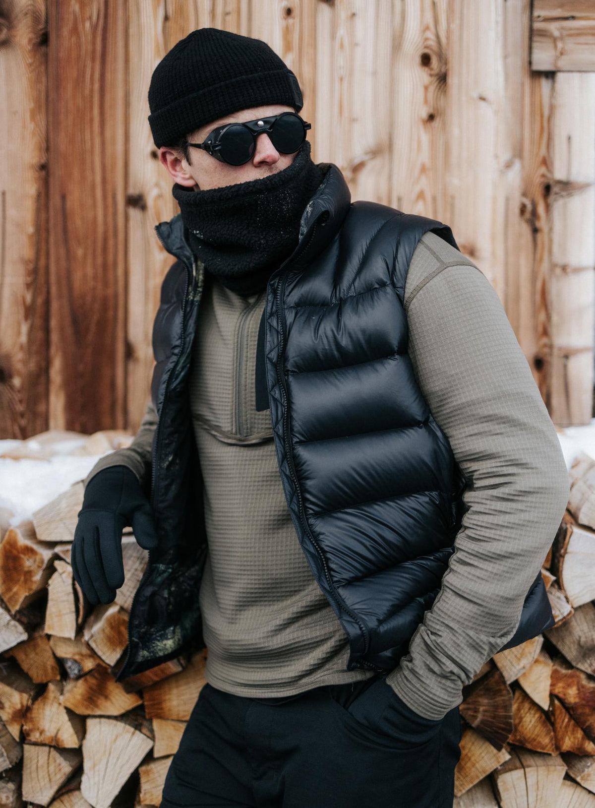 An in the field image of Men's Bastion Down Gilet in Obsidian Black (ITF)