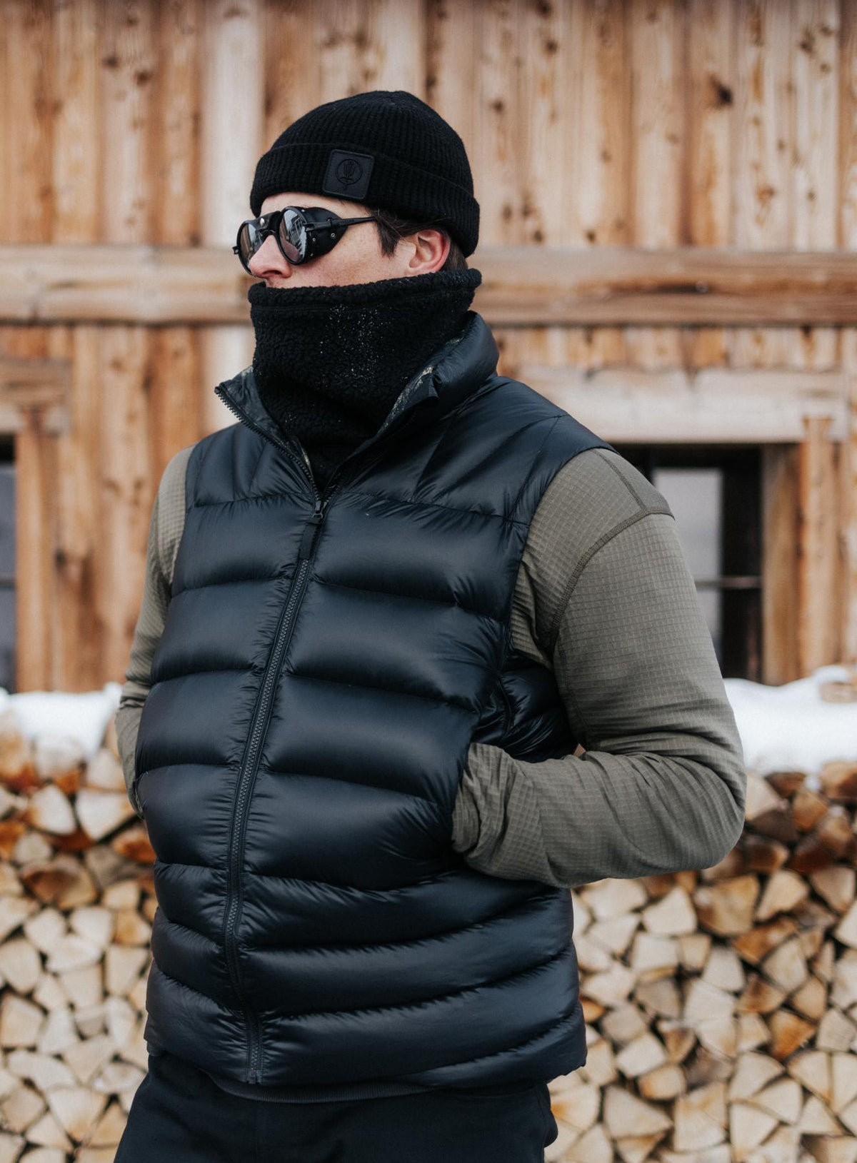 An in the field image of Men's Bastion Down Gilet in Obsidian Black (ITF)