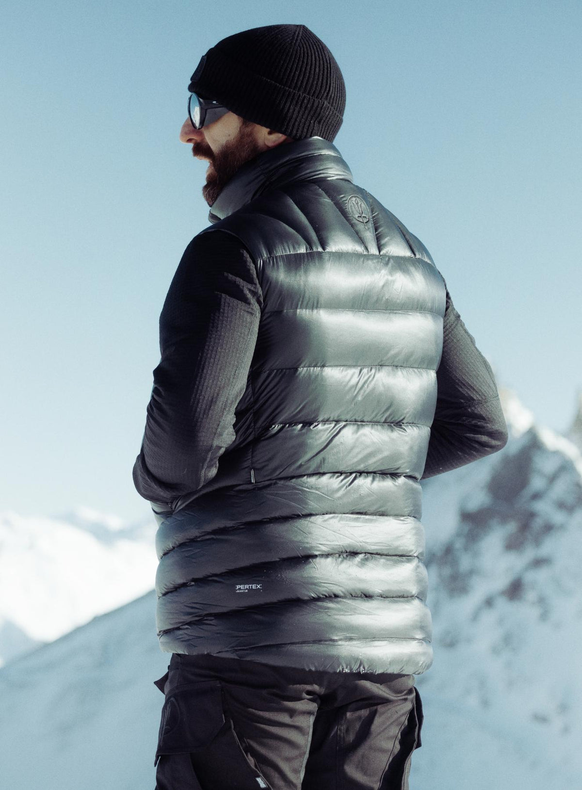 An in the field image of Men's Bastion Down Gilet in Obsidian Black (ITF)