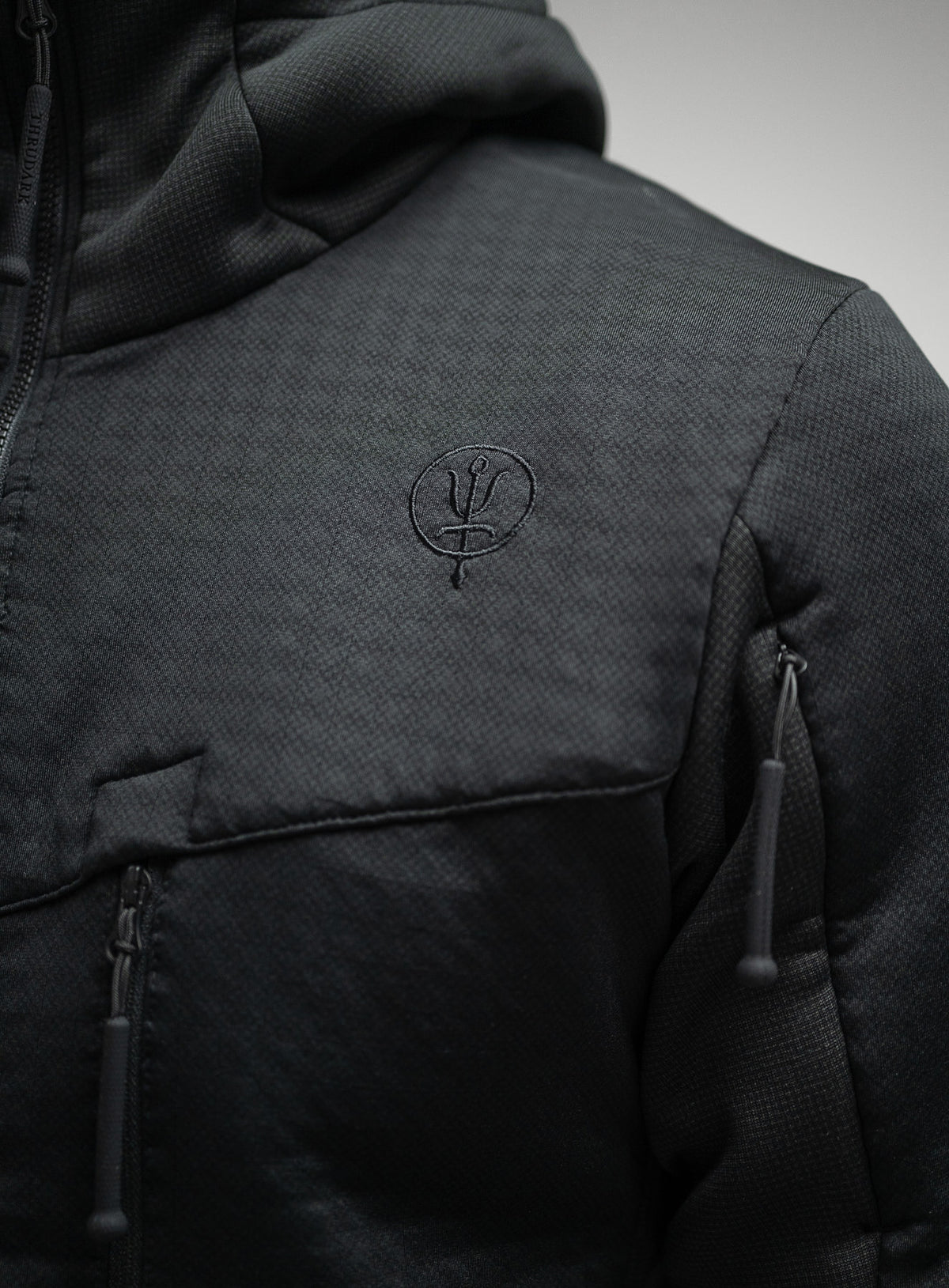 Embroidered Insignia Chest Logo