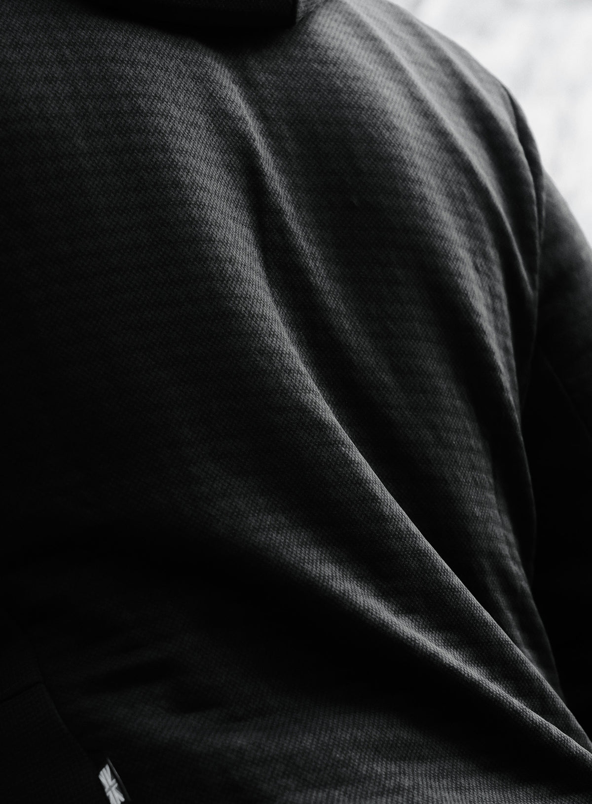A creative studio shot of Centurion Jacket in Obsidian Black (CS)