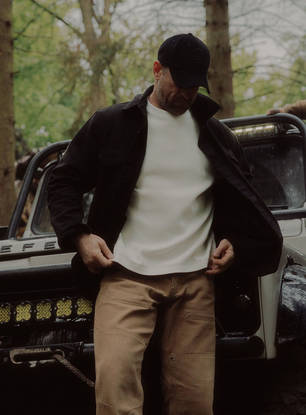 An in the field image of Men's Dissident Canvas Jacket in Obsidian Black (ITF)