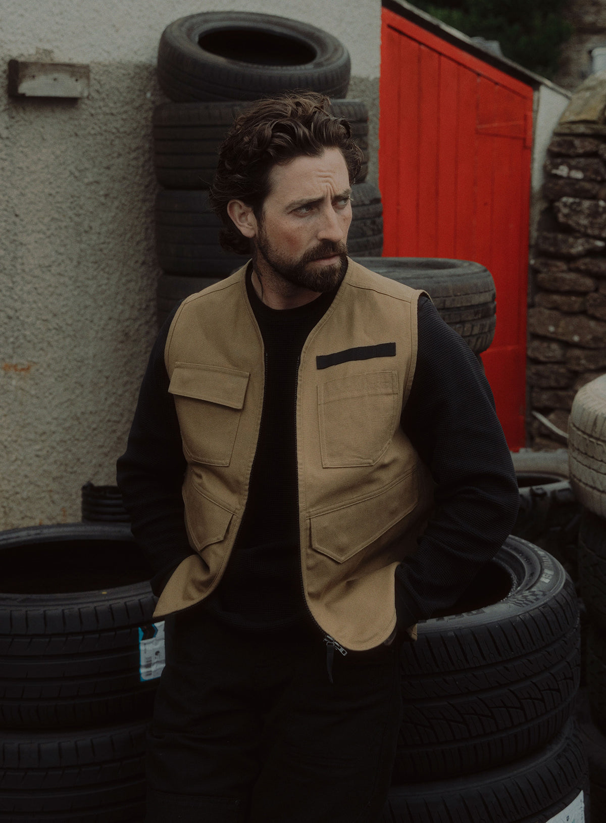 An in the field image of Men's Dissident Utility Vest in Coyote Brown (ITF)