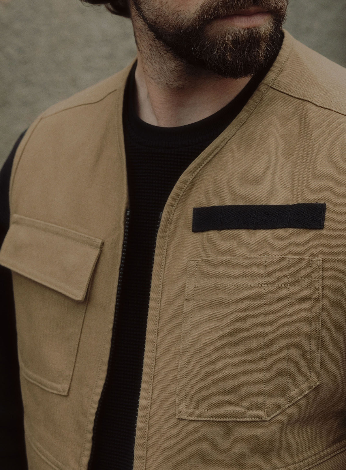 An in the field image of Men's Dissident Utility Vest in Coyote Brown (ITF)