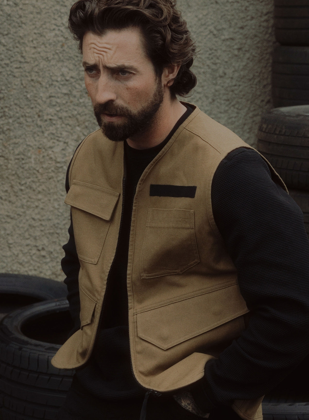 An in the field image of Men's Dissident Utility Vest in Coyote Brown (ITF)