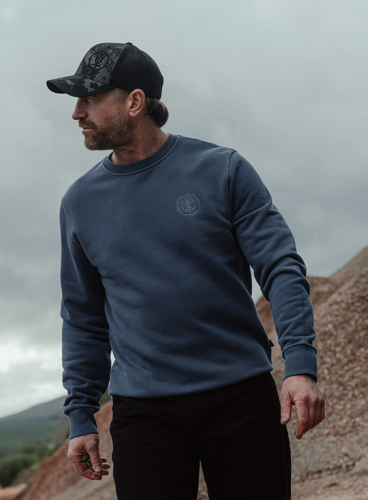 An in the field image of Dissident Washed Jumper in Navy (ITF)