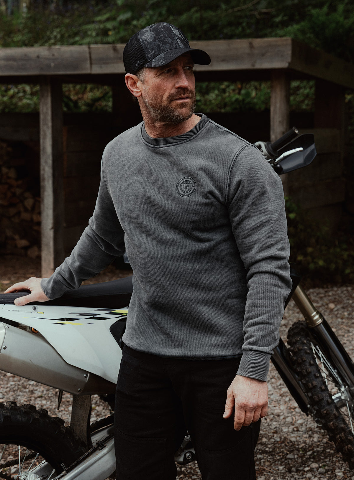 An in the field image of Dissident Washed Jumper in Obsidian Black (ITF)