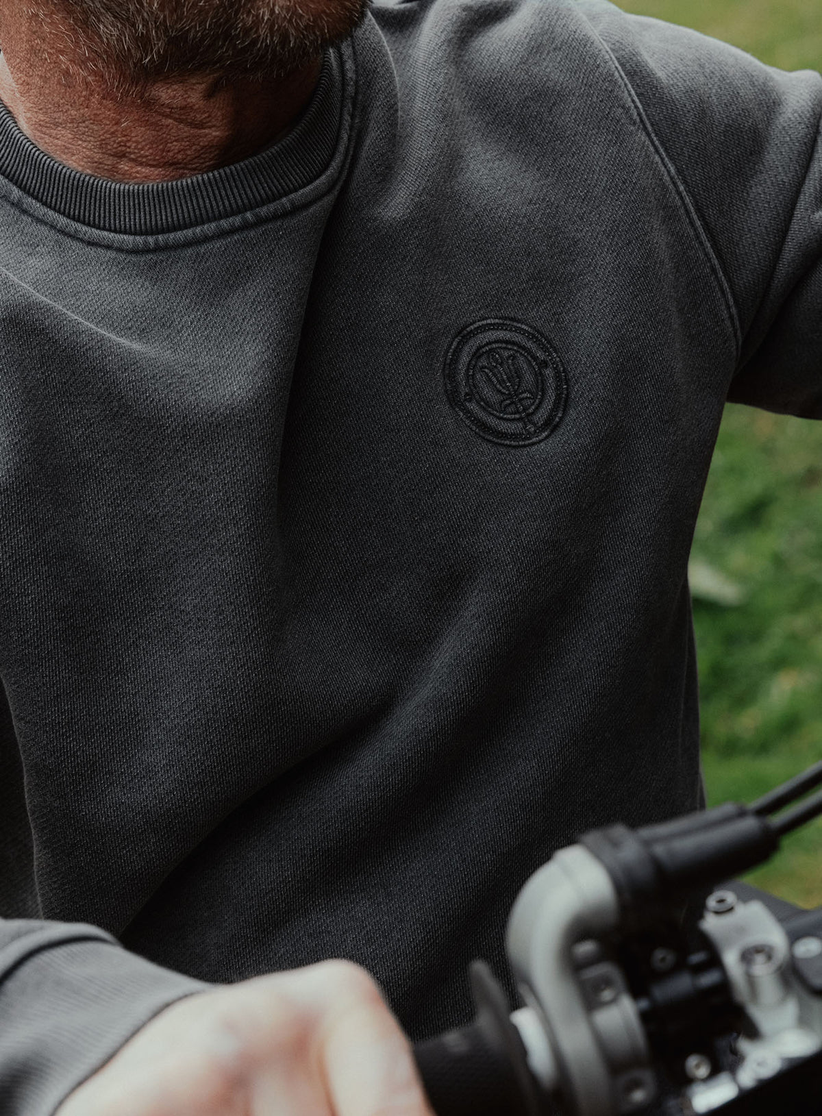 An in the field image of Dissident Washed Jumper in Obsidian Black (ITF)