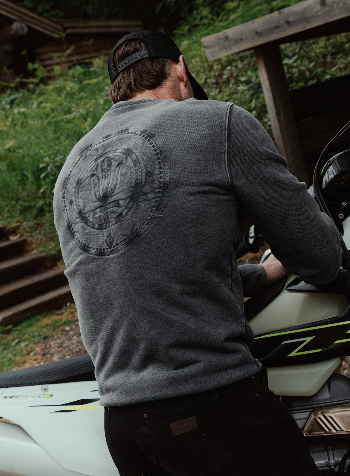 An in the field image of Dissident Washed Jumper in Obsidian Black (ITF)