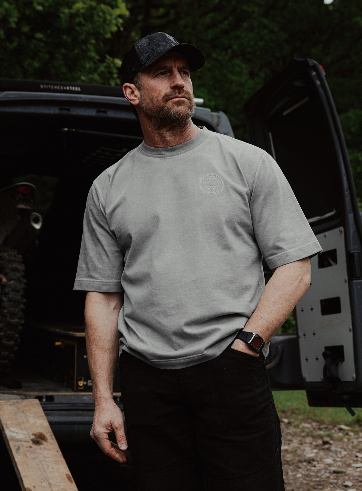 An in the field image of Dissident Washed T-Shirt in Grey (ITF)