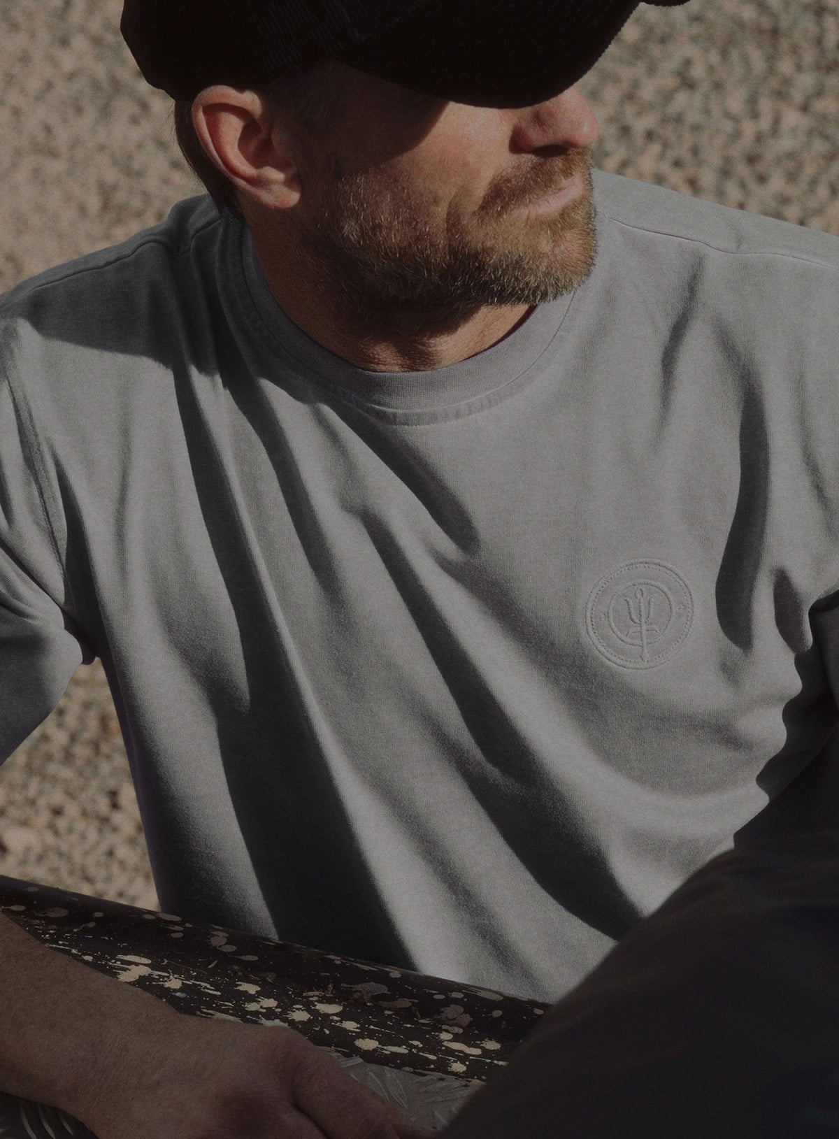 An in the field image of Dissident Washed T-Shirt in Grey (ITF)