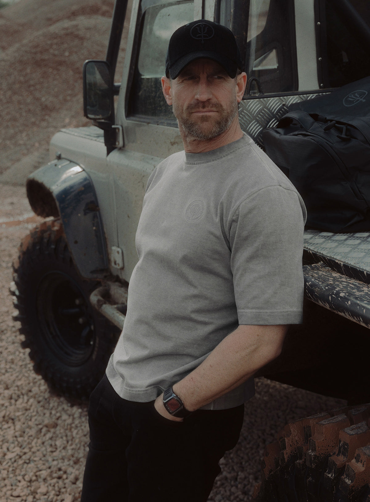 An in the field image of Dissident Washed T-Shirt in Grey (ITF)