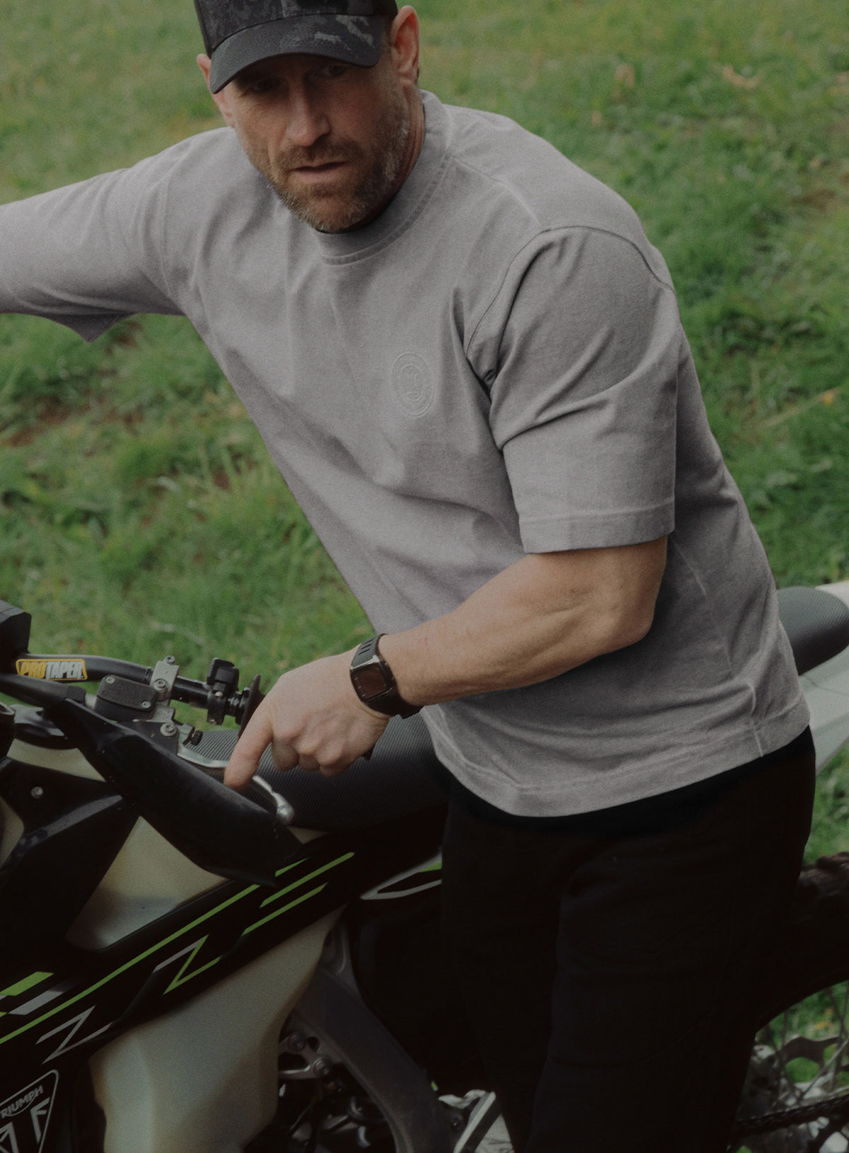 An in the field image of Dissident Washed T-Shirt in Grey (ITF)